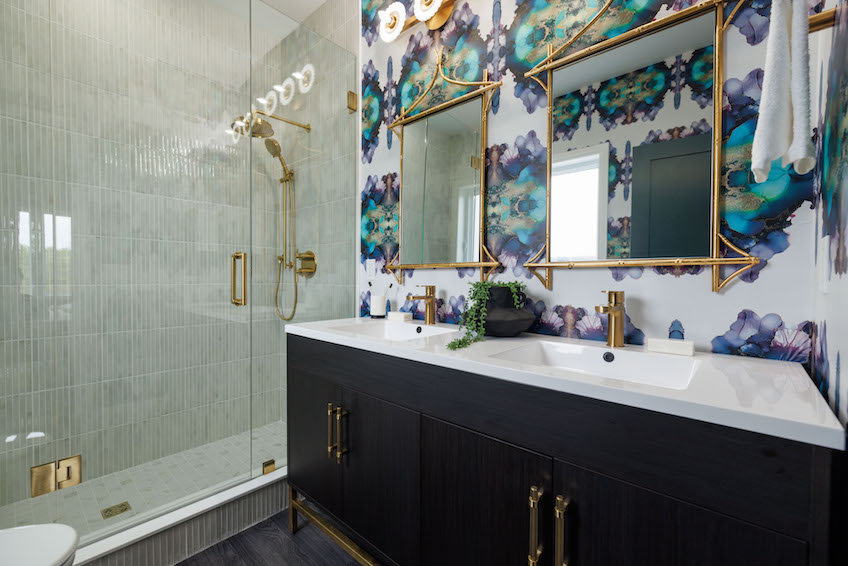 Double vanity with walk in shower and blue finishes