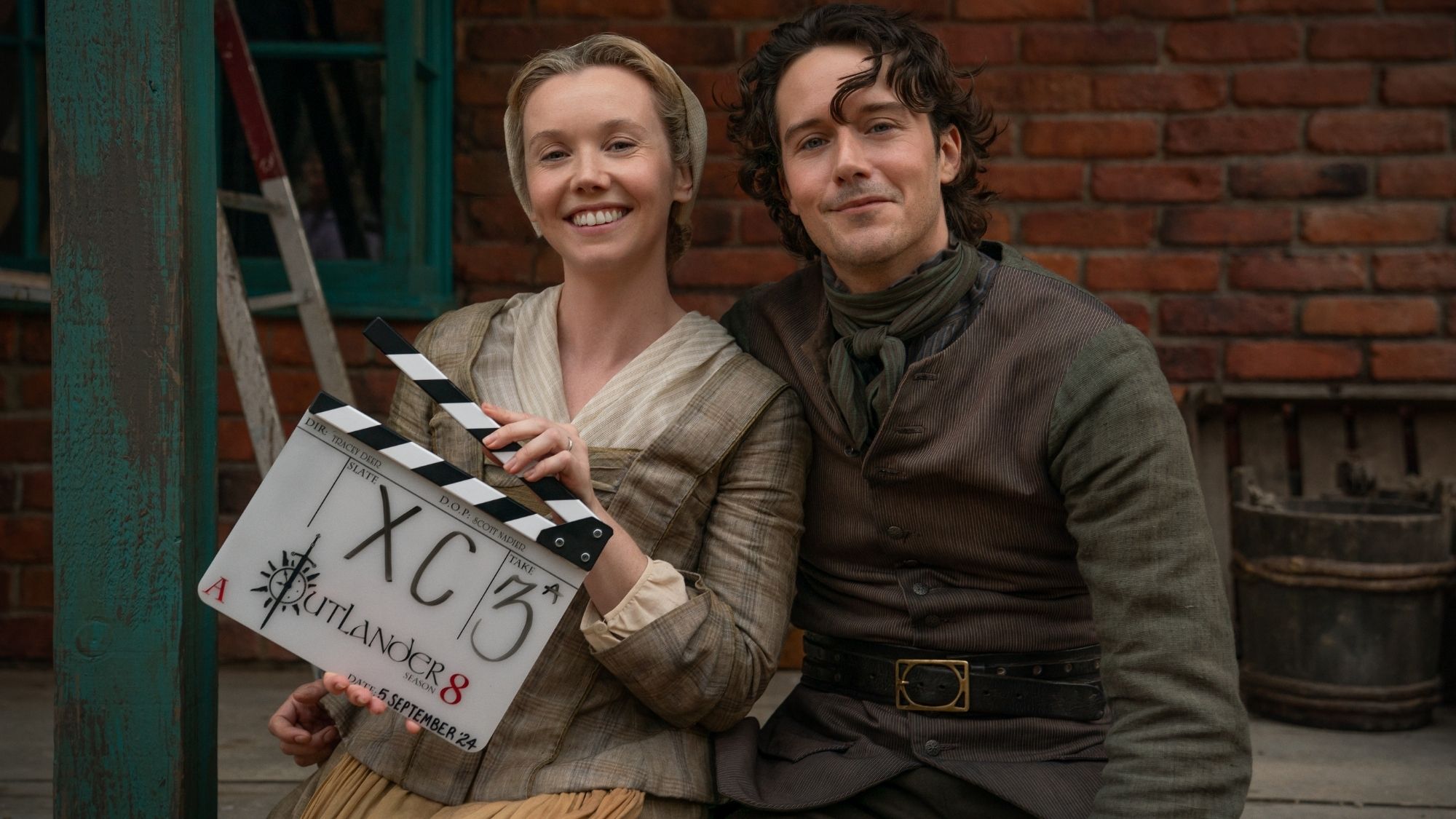 Outlander cast with season 8 slate