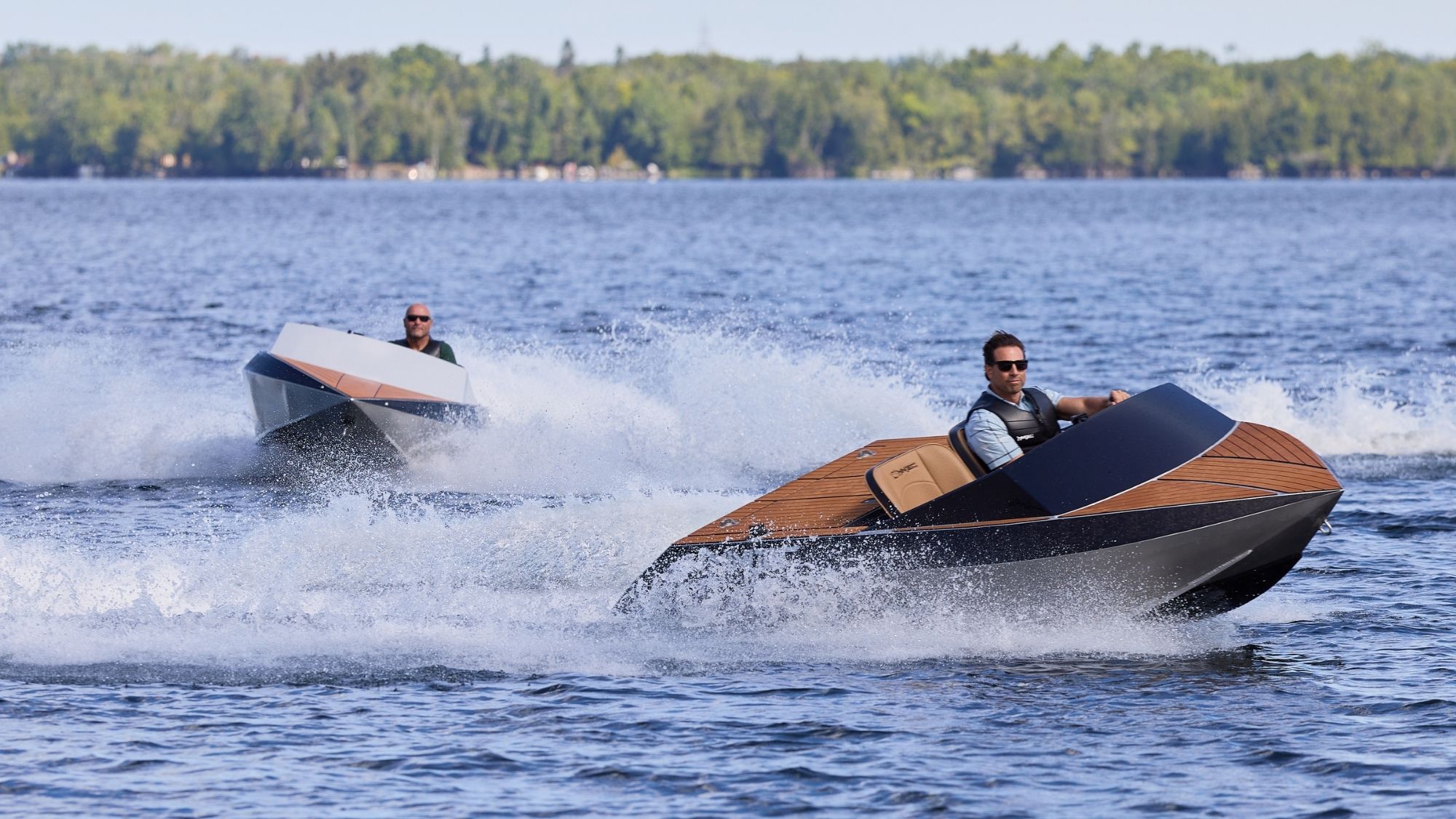 Scott and Bryan on boats on lake in Renovation Resort